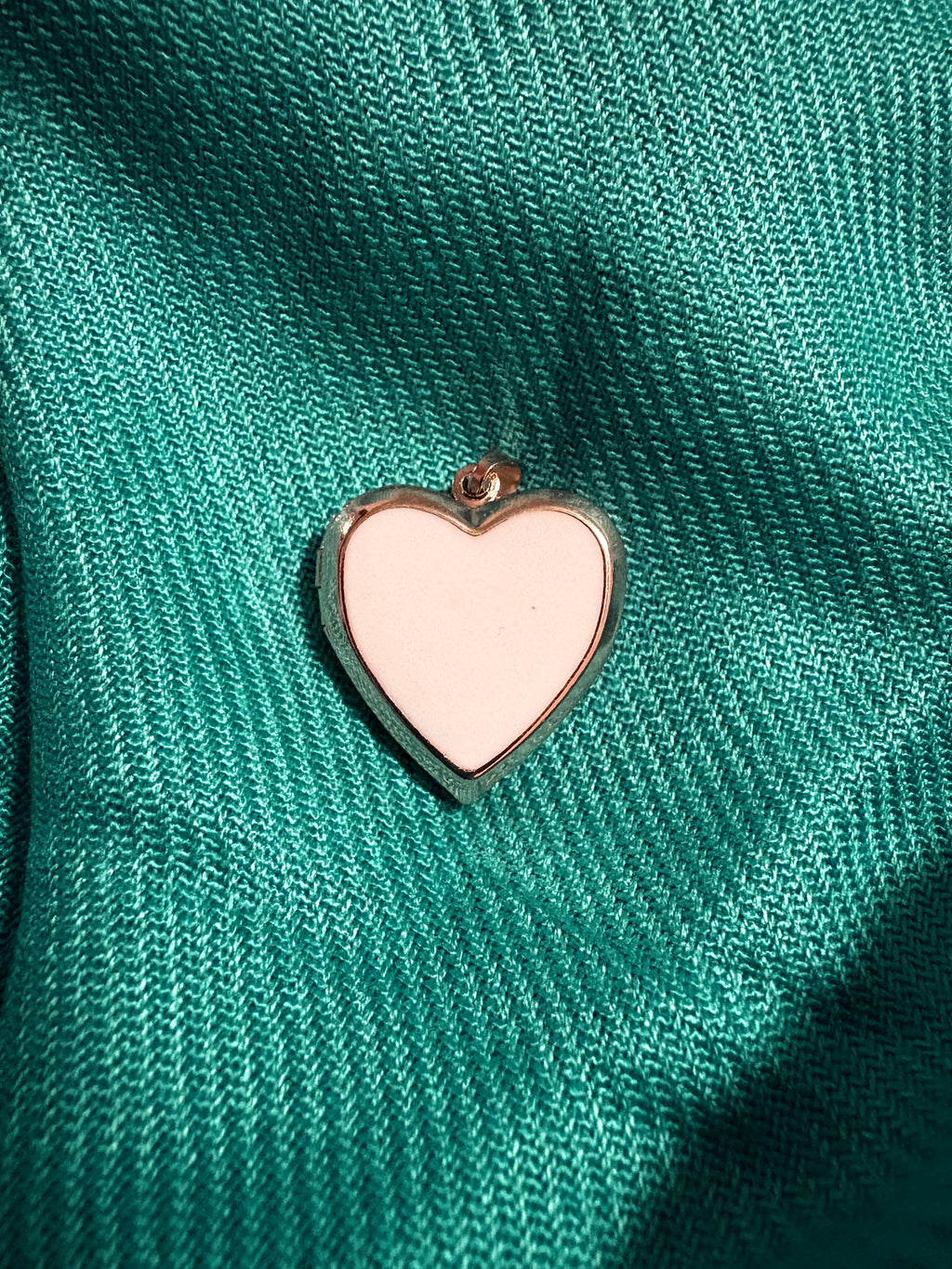 Gold and white heart shaped locket