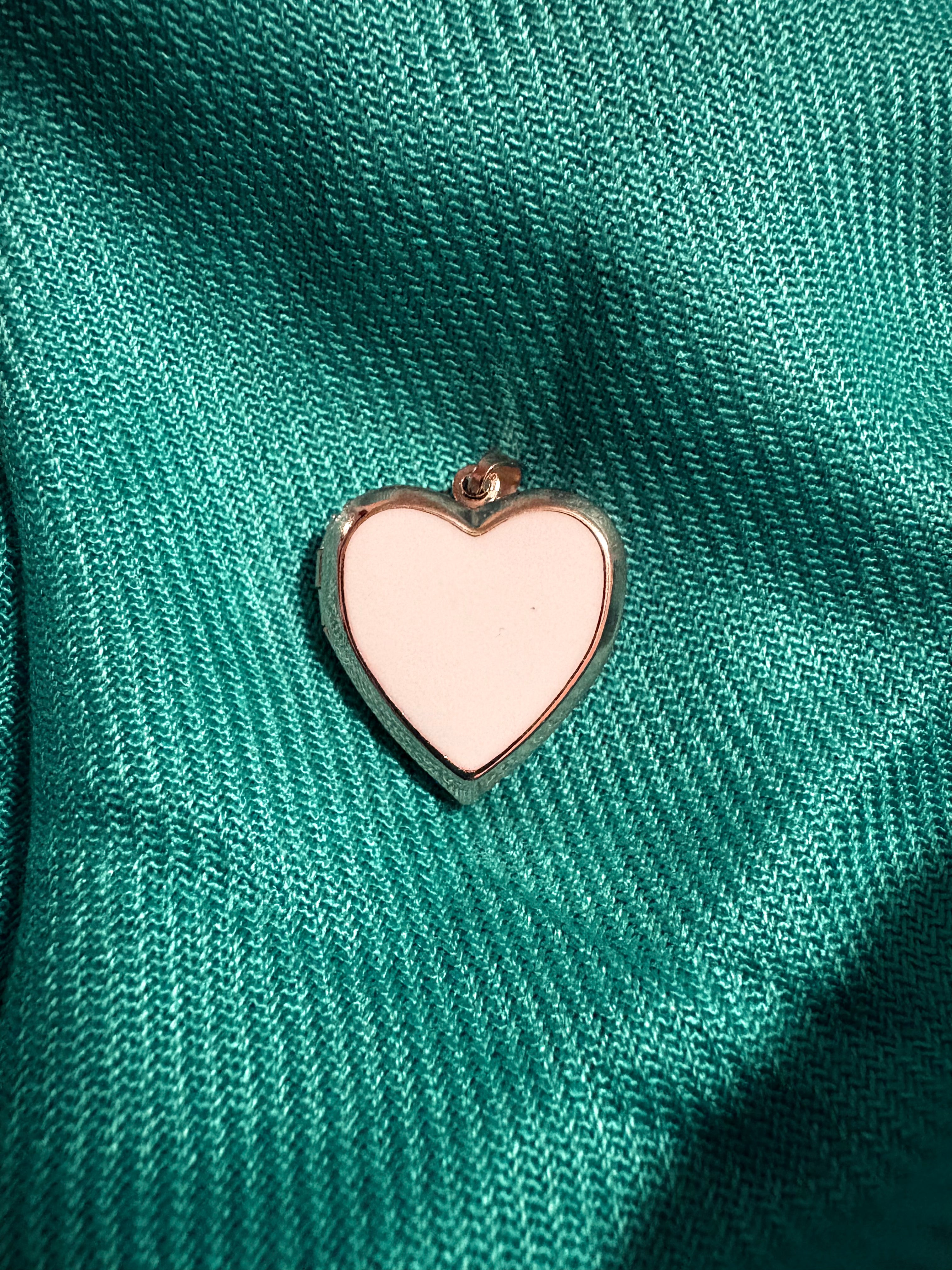 Gold and white heart shaped locket