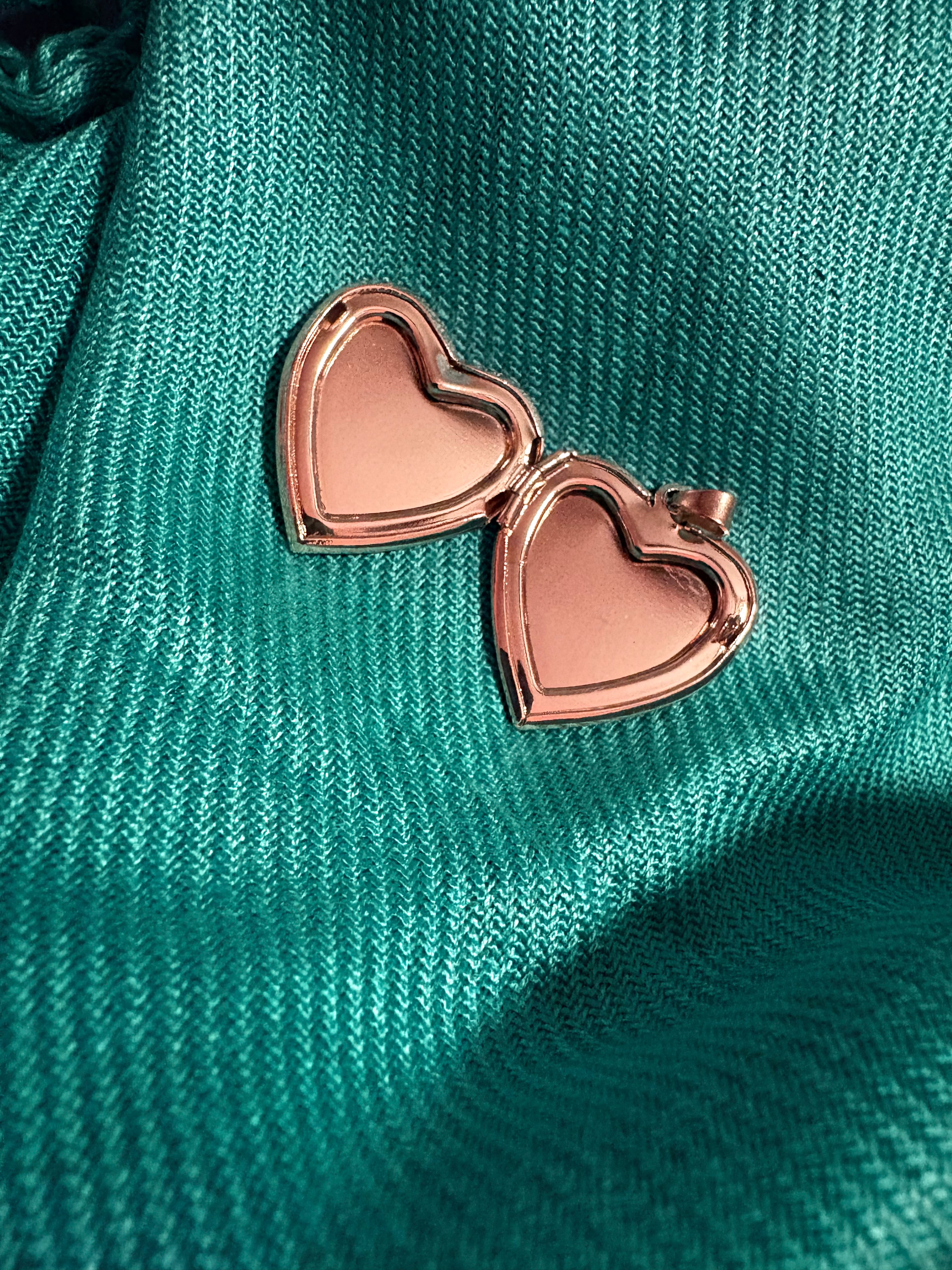 Gold and white heart shaped locket