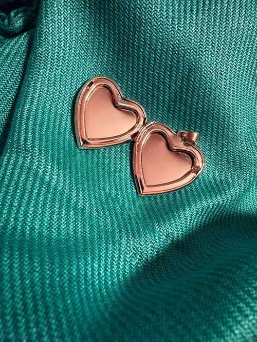 Gold and white heart shaped locket